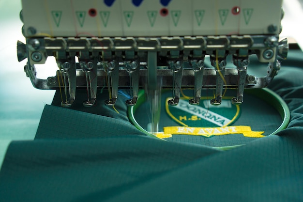 closeup-sewing-machine-needle-cloth-seamstress